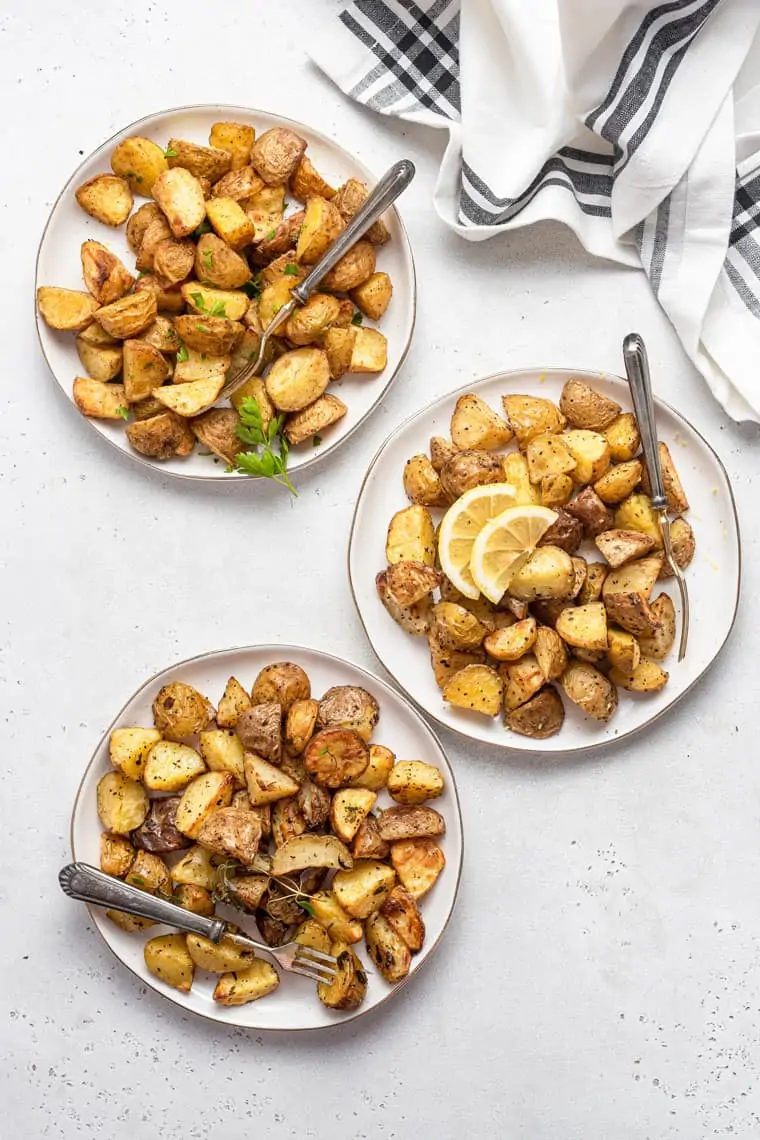 three plates of roasted potatoes