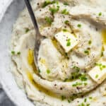 close up on mashed cauliflower with chives and butter