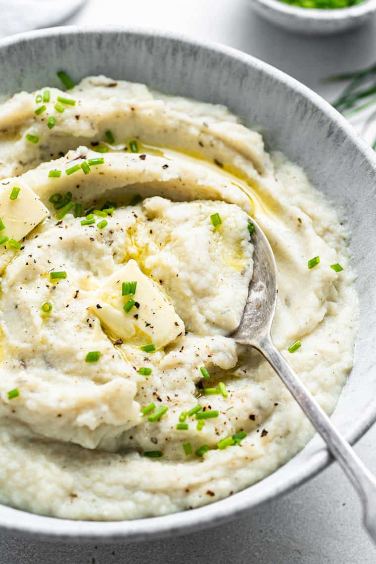 bowl of creamy mashed cauliflower with butter