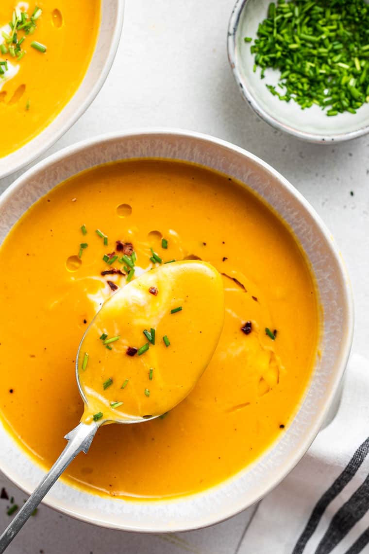 bowl of ginger sweet potato soup with chives