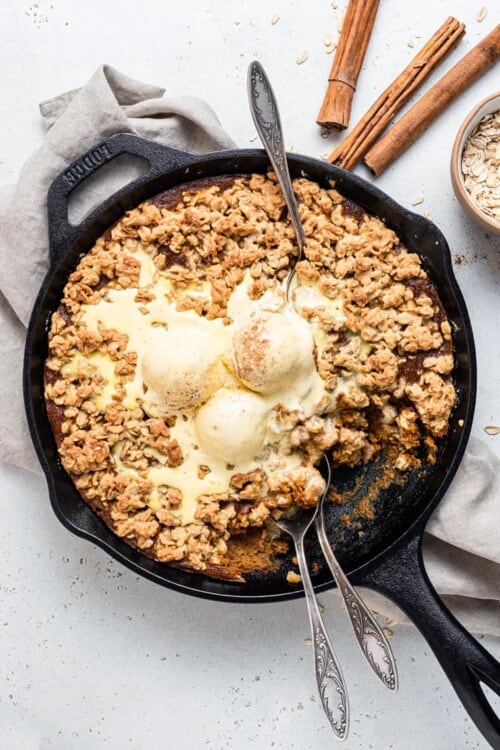 whole pumpkin crisp in a skillet with ice cream