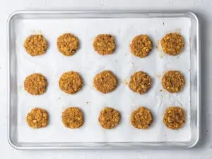 baking sheet with uncooked pumpkin cookies