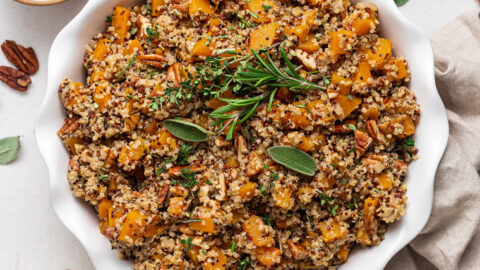 white plate of quinoa stuffing with fresh herbs