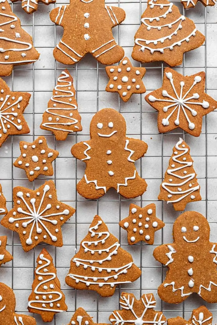 decorated vegan gingerbread cookies on a wire rack