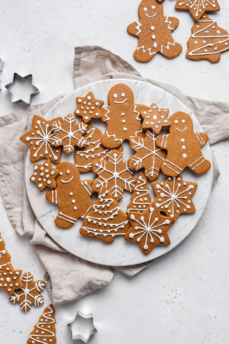 plate of gingerbread cookies with royal icing