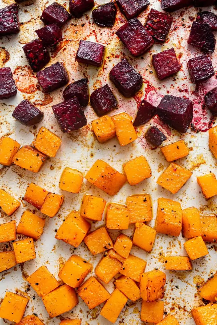 roasted beets and squash on a baking sheet