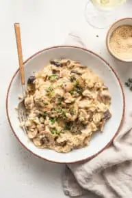 bowl of mushroom risotto with fresh herbs