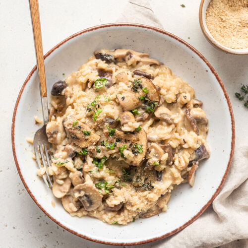 bowl of mushroom risotto with fresh herbs