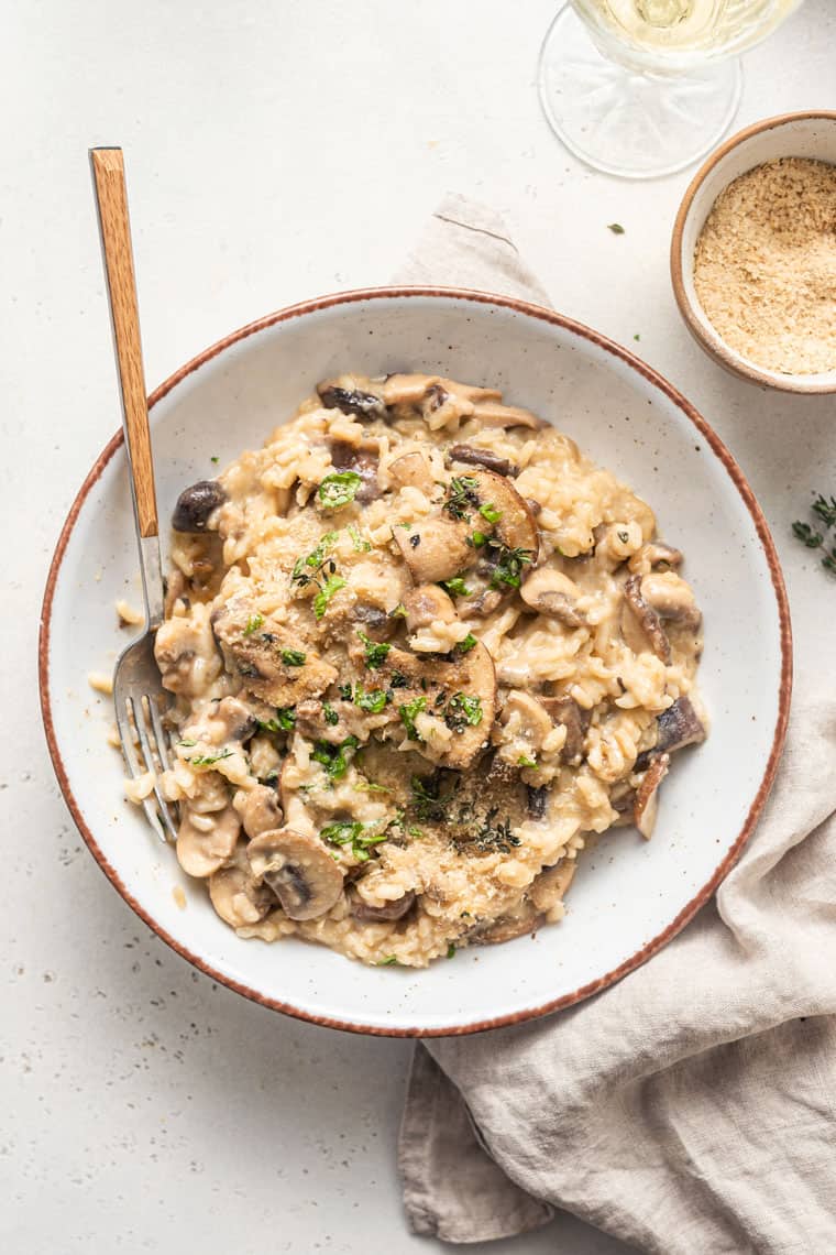 bowl of mushroom risotto with fresh herbs