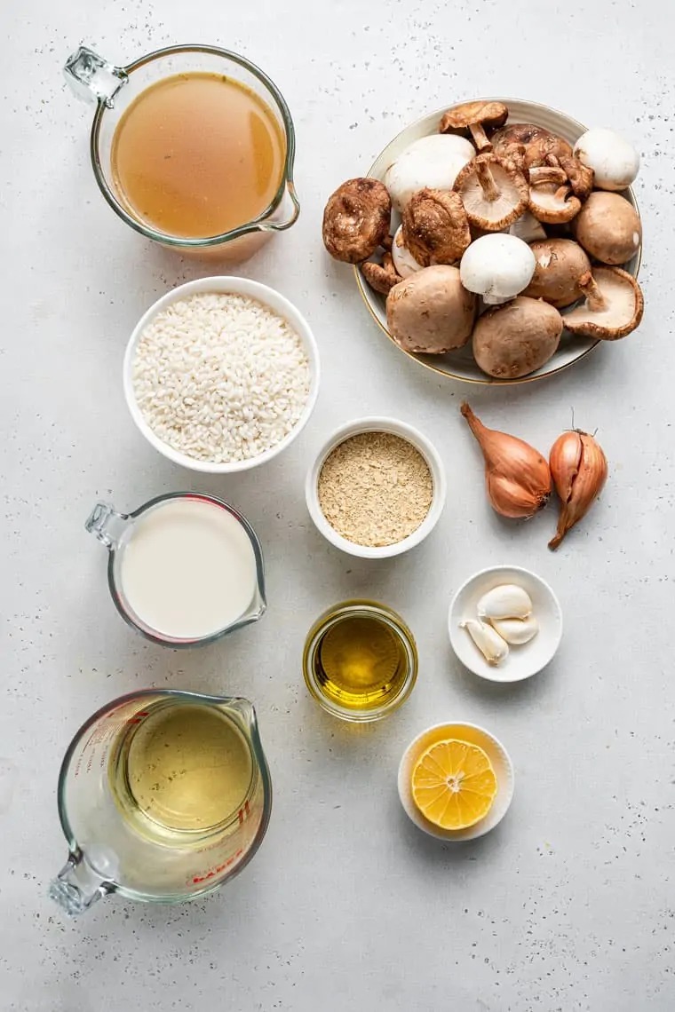 ingredients for risotto with mushrooms, broth and lemon juice