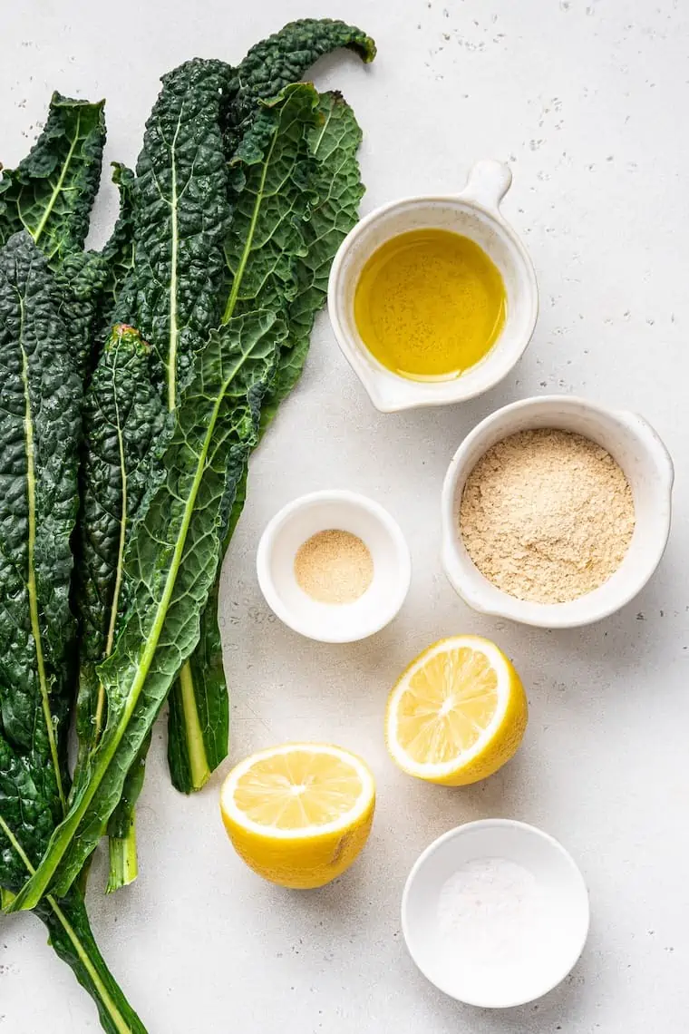 ingredients for kale salad with nutritional yeast, lemon and olive oil