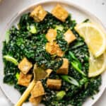 tofu and massaged kale salad on a fork