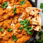 skillet of lentil curry with naan