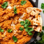 skillet of sweet potato curry with naan