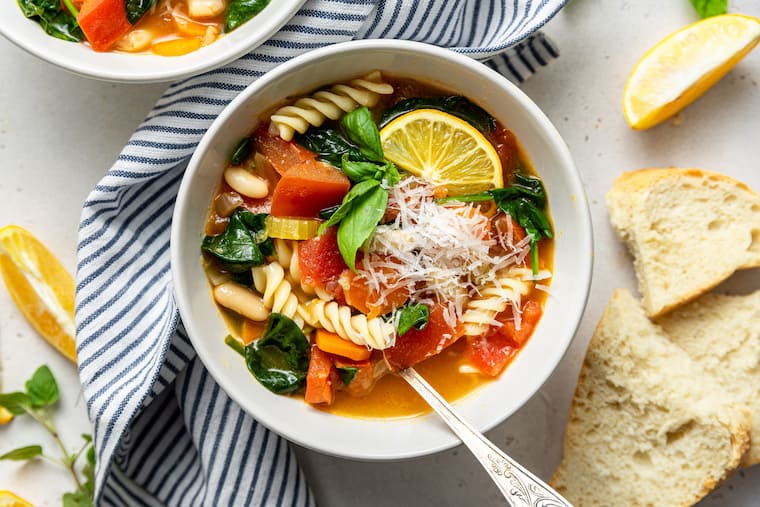 bowl of vegetable and pasta soup with cheese
