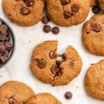Overhead of vegan chocolate chip cookies on parchment paper.