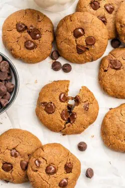 Overhead of vegan chocolate chip cookies on parchment paper.