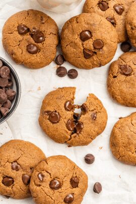 Overhead of vegan chocolate chip cookies on parchment paper.