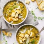 two bowls of vegetarian split pea soup with toasted bread.