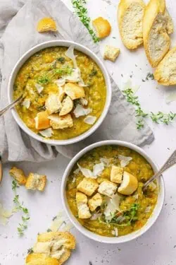 two bowls of vegetarian split pea soup with toasted bread.