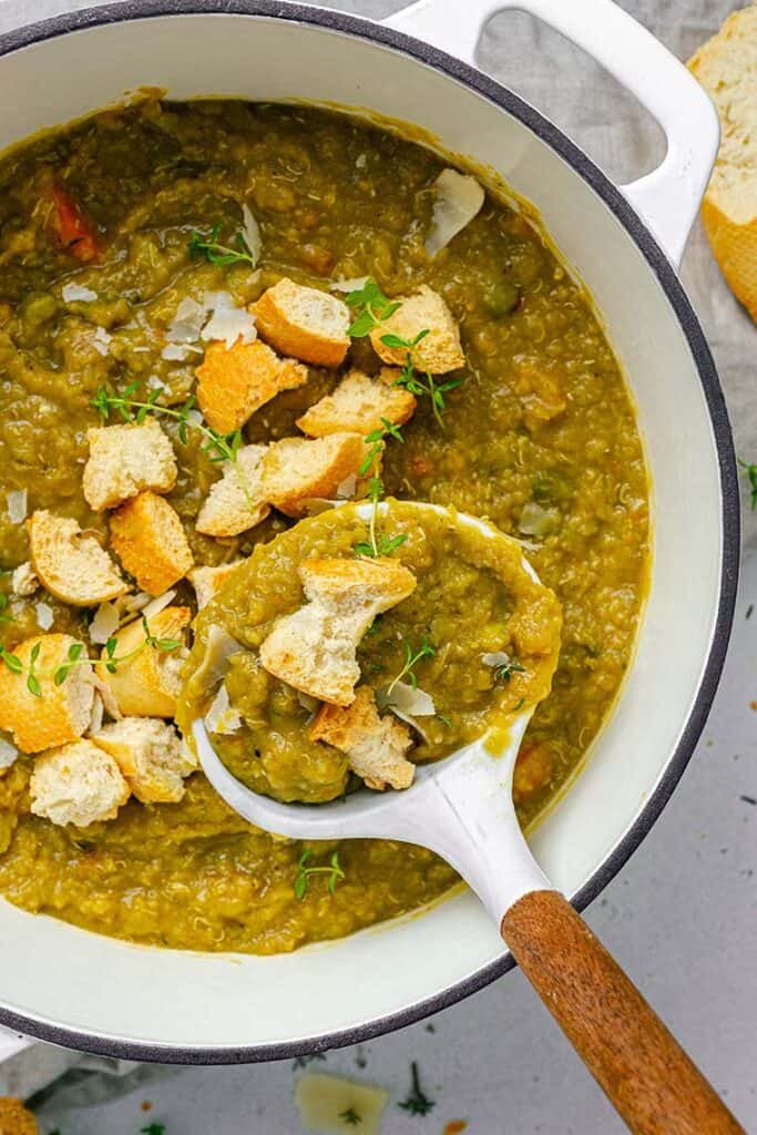 pot of split pea soup with a ladle