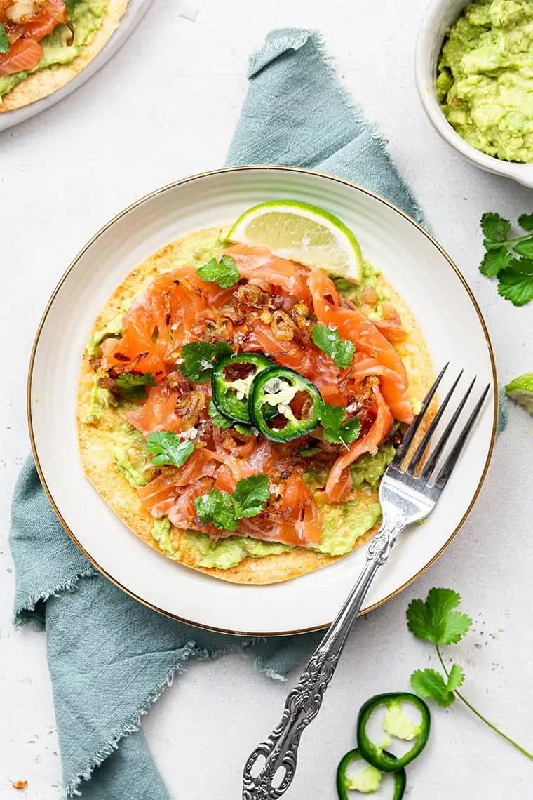 salmon tostada with mashed avocado