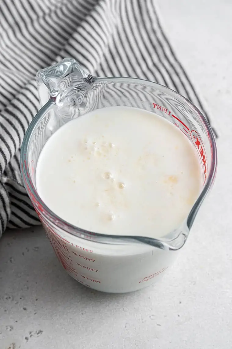 glass measuring cup with vegan buttermilk