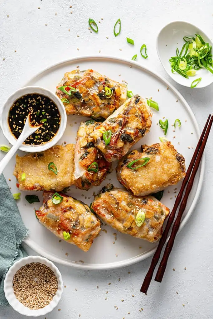 plate of rice paper dumplings with dipping sauce