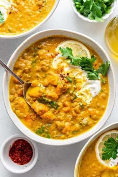 Overhead view of bowls of turmeric lentil soup