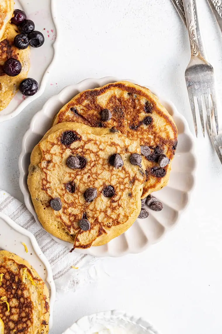 Plate topped with 2 blueberry gluten-free pancakes