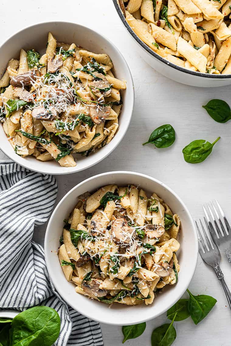 two bowls of mushroom spinach pasta