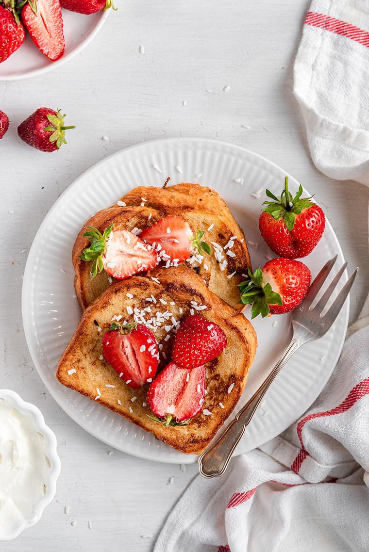 serving vegan french toast with strawberries