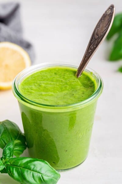 Jar of avocado green goddess dressing with spoon