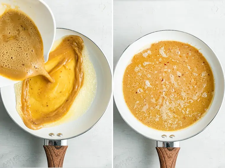 A bowl of uncooked scrambled egg mixture being poured into a buttery pan, next to a pan with the egg mixture in it