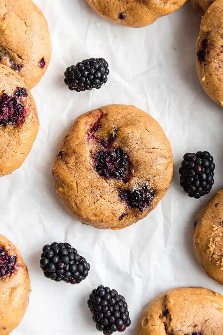 Overhead view of blackberry cookie surrounded by fresh berries