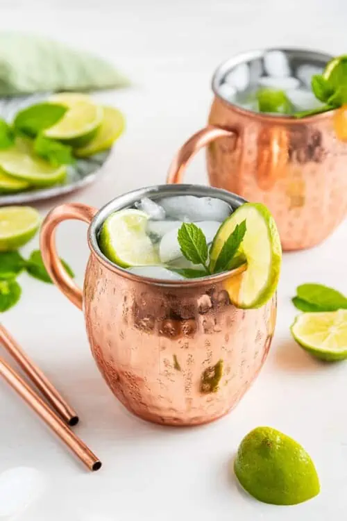Two copper mugs of Mexican mule cocktail