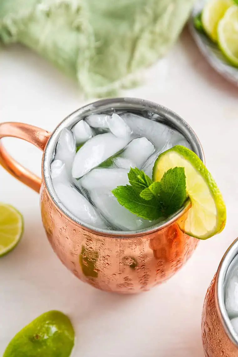 Mexican mule in copper mug with mint and lime wheel garnish