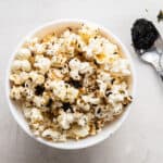 Bowl of umami popcorn with spoon of nori