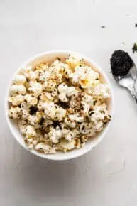 Bowl of umami popcorn with spoon of nori