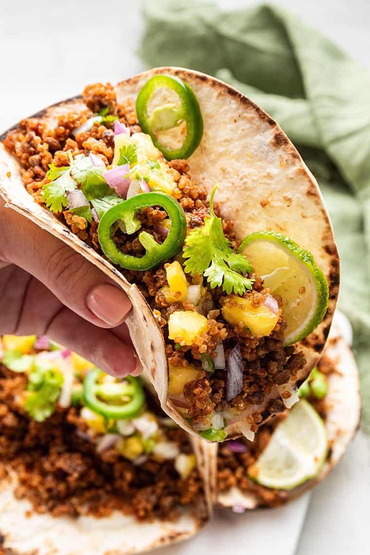 This easy vegan taco meat is made with lentils and quinoa. Unbelievably delicious, super healthy, and ideal for meal prep! Vegan taco filled with lentil and quinoa "meat"