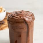 A jar overflowing with homemade nutella.