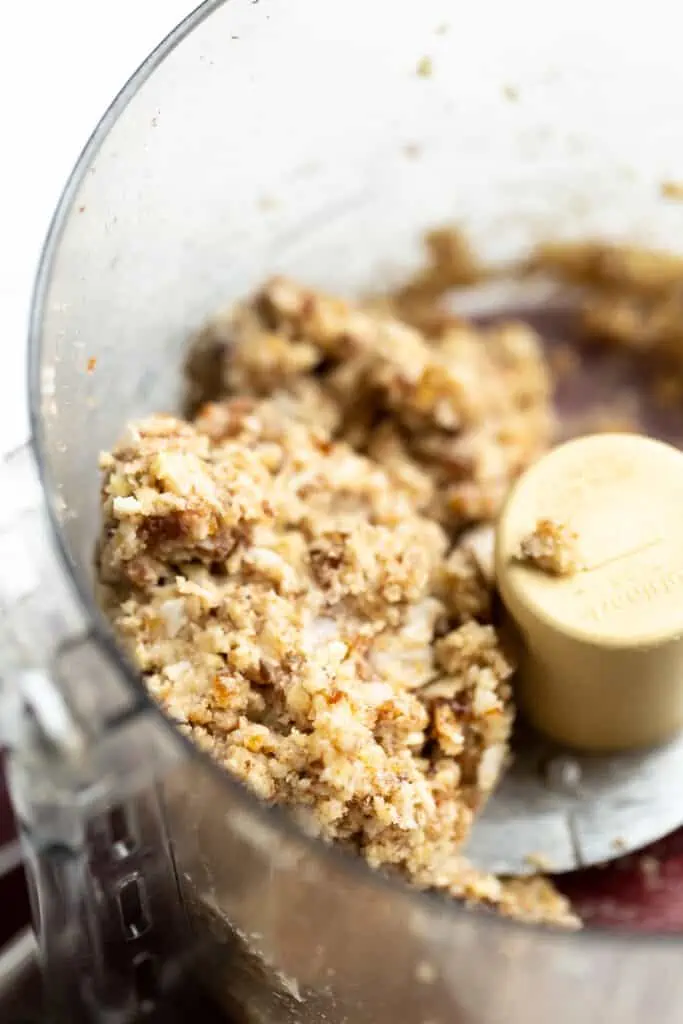 Gluten-free apple crisp topping inside a food processor.