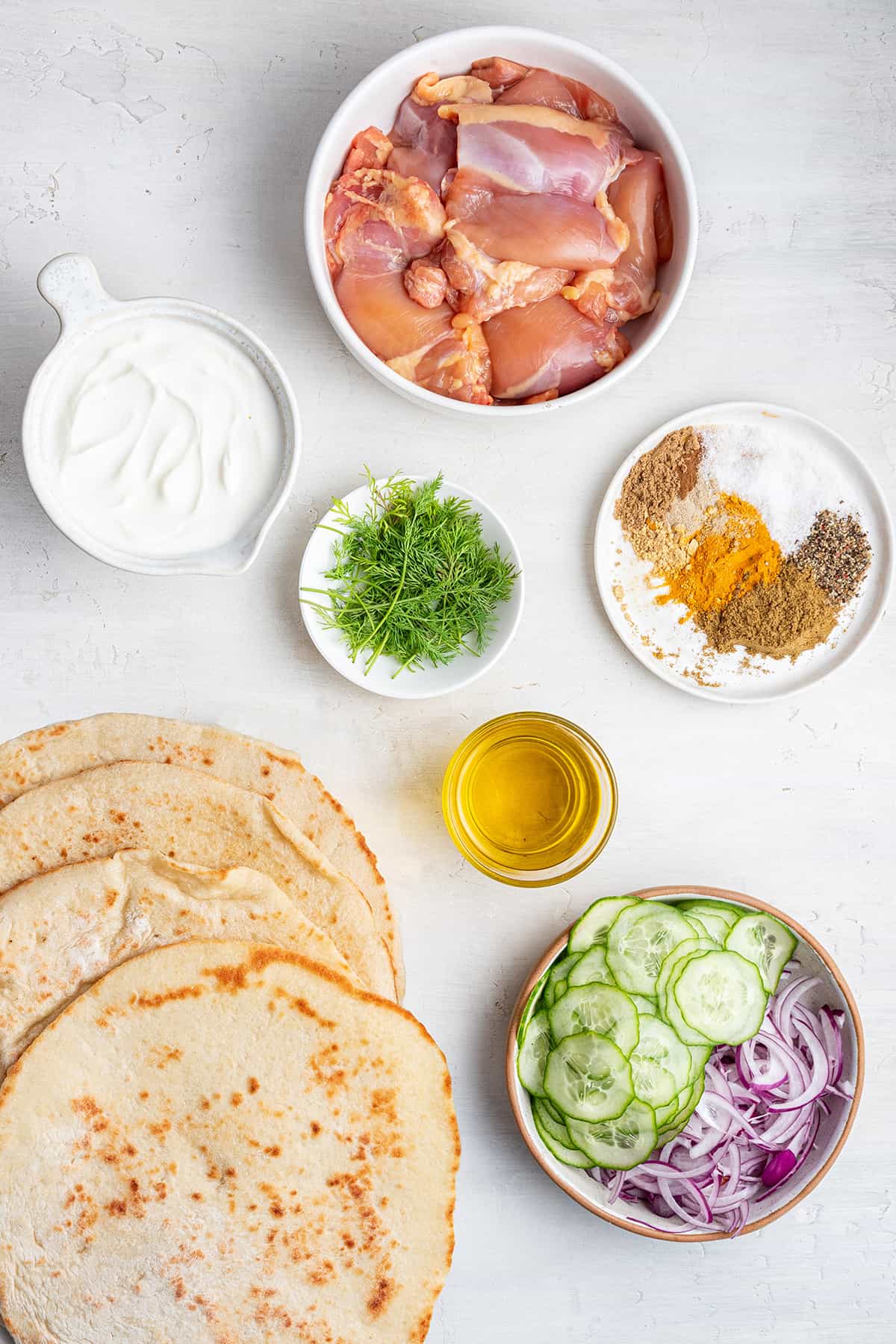 Overhead view of ingredients for chicken shawarma gyros