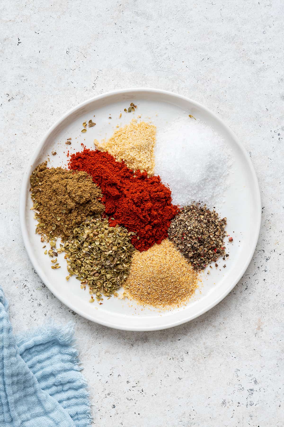 Overhead view of blackened seasoning ingredients on plate