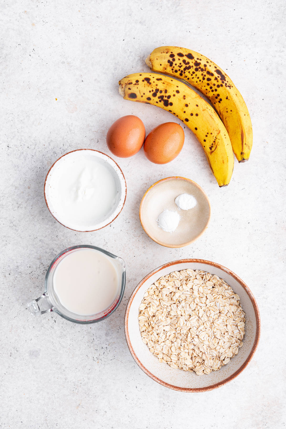 Overhead view of ingredients for oatmeal banana pancakes