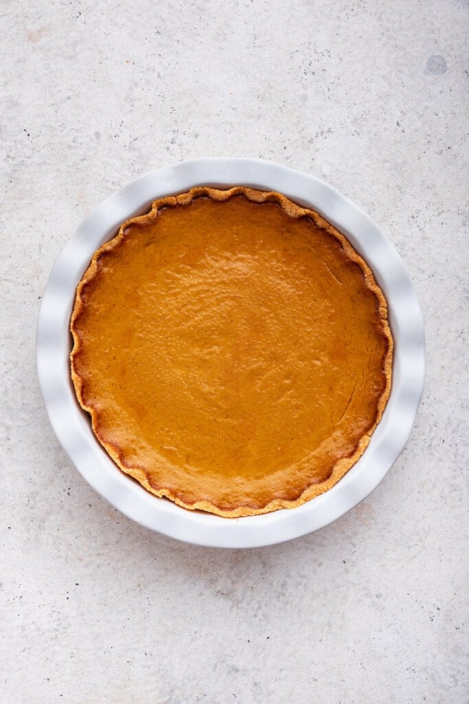 Overhead view of gluten-free pumpkin pie in white plate