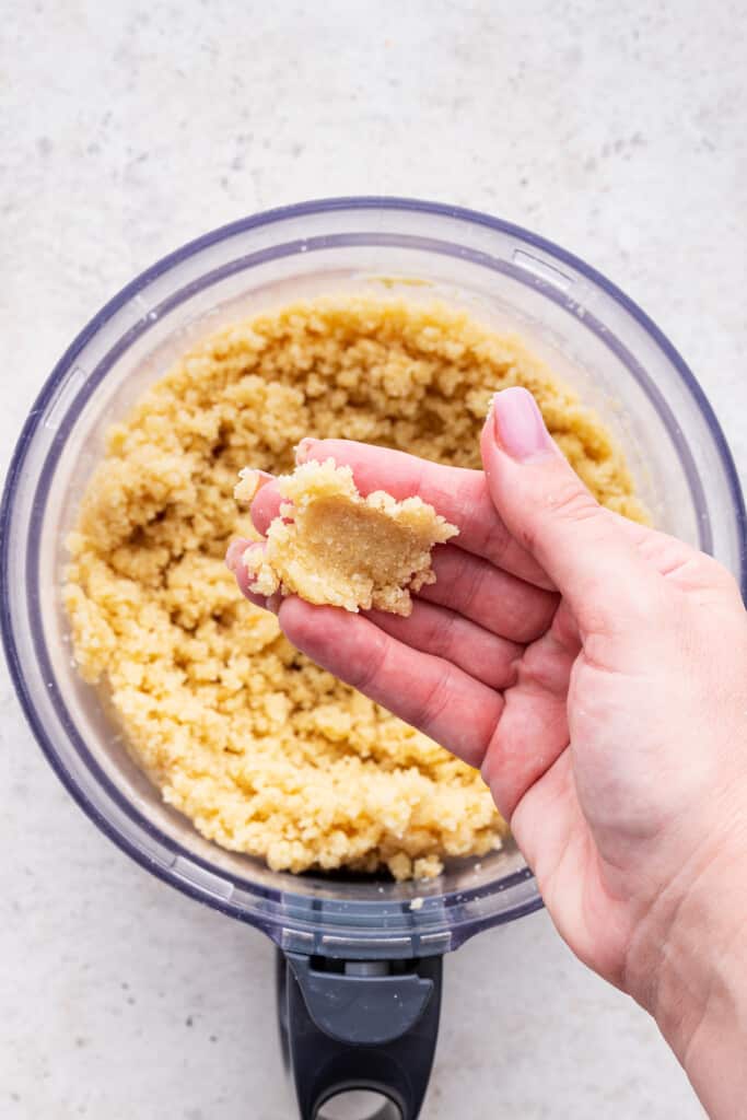 Overhead view of pie crust dough in hand