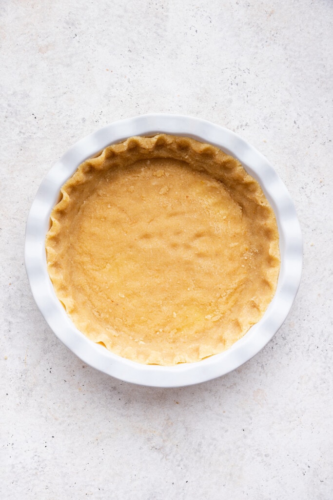 Overhead view of almond flour pie crust in pan