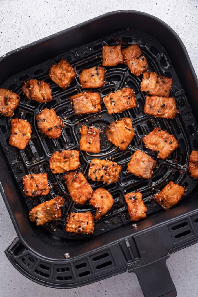 Salmon bites in air fryer basket