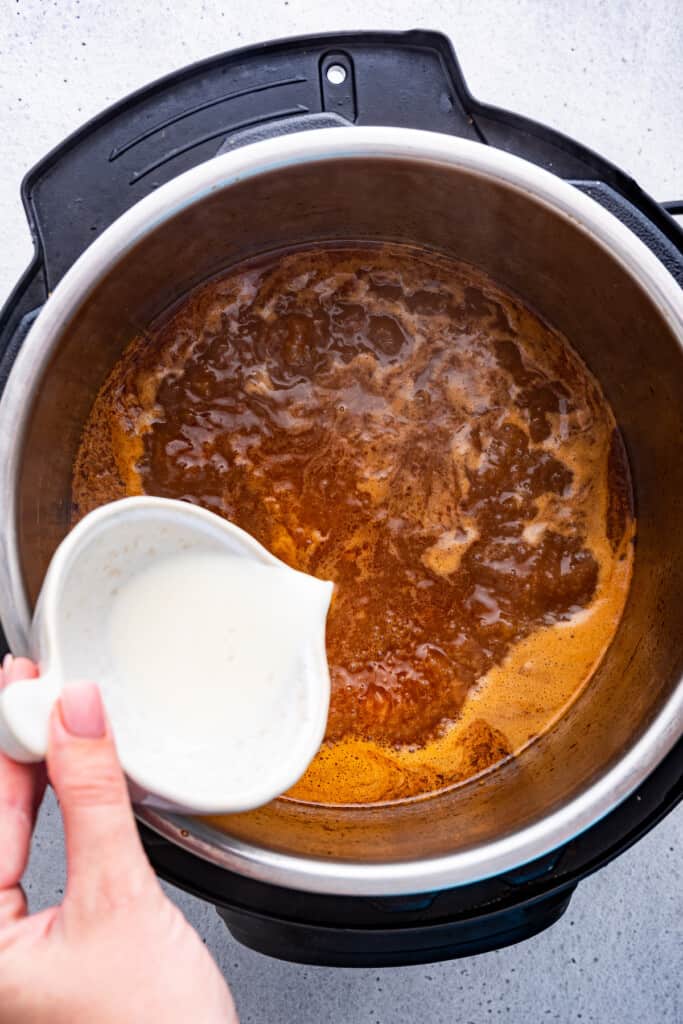 Pouring cornstarch slurry into Instant Pot